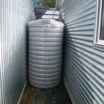 Jan 16, 2014: Rainwater tank delivered today. Tight squeeze between the house and the garage but made it.