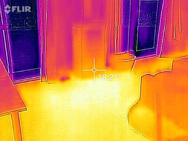 IR image of the new house showing the heat stored in the floor from the fireplace.